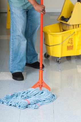 Free Spot Cleaning janitor in Belle Isle, FL mopping floor.